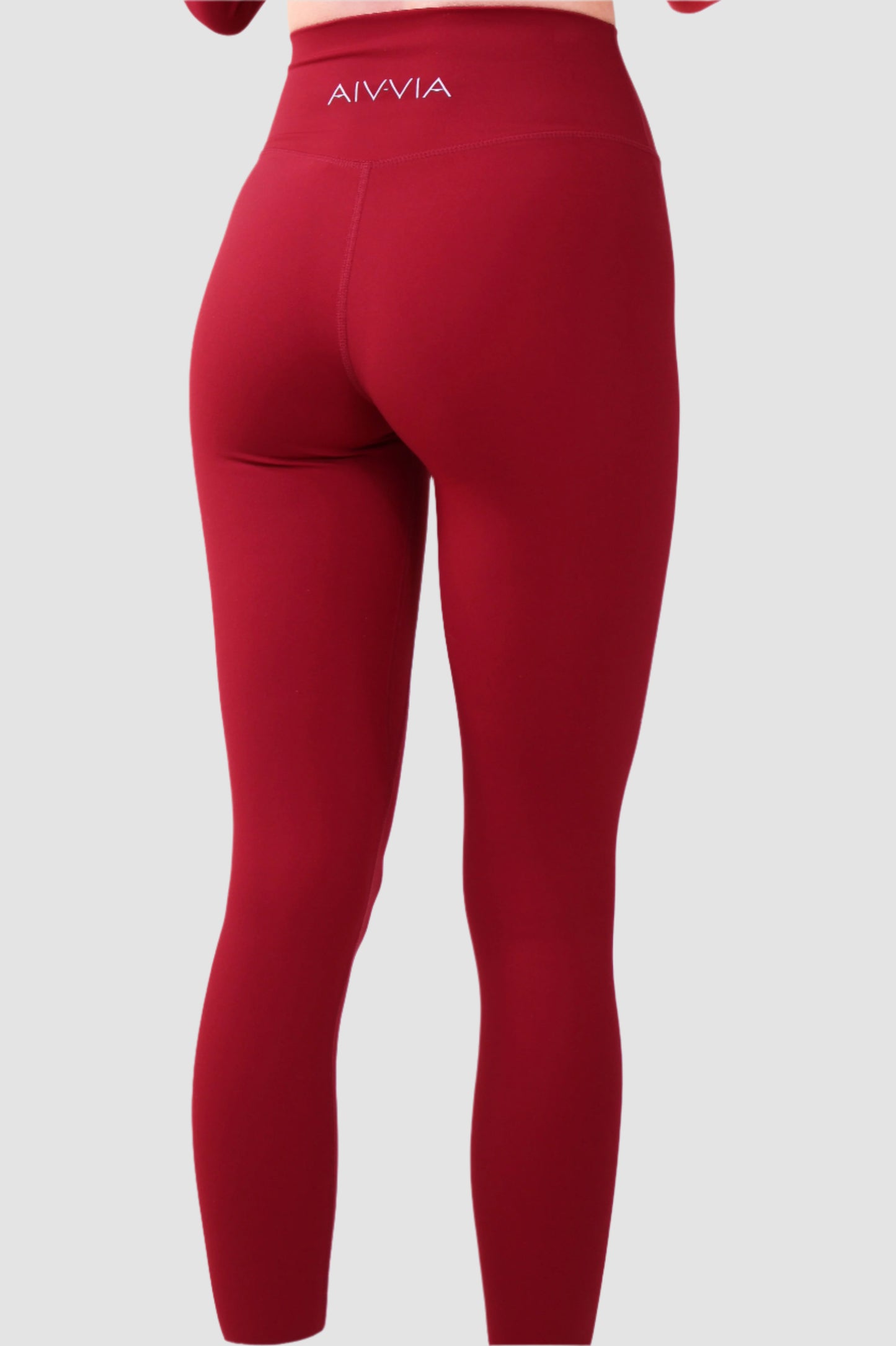 Back view of red Aivvia Athletics sports bra with wide band for secure, supportive wear.