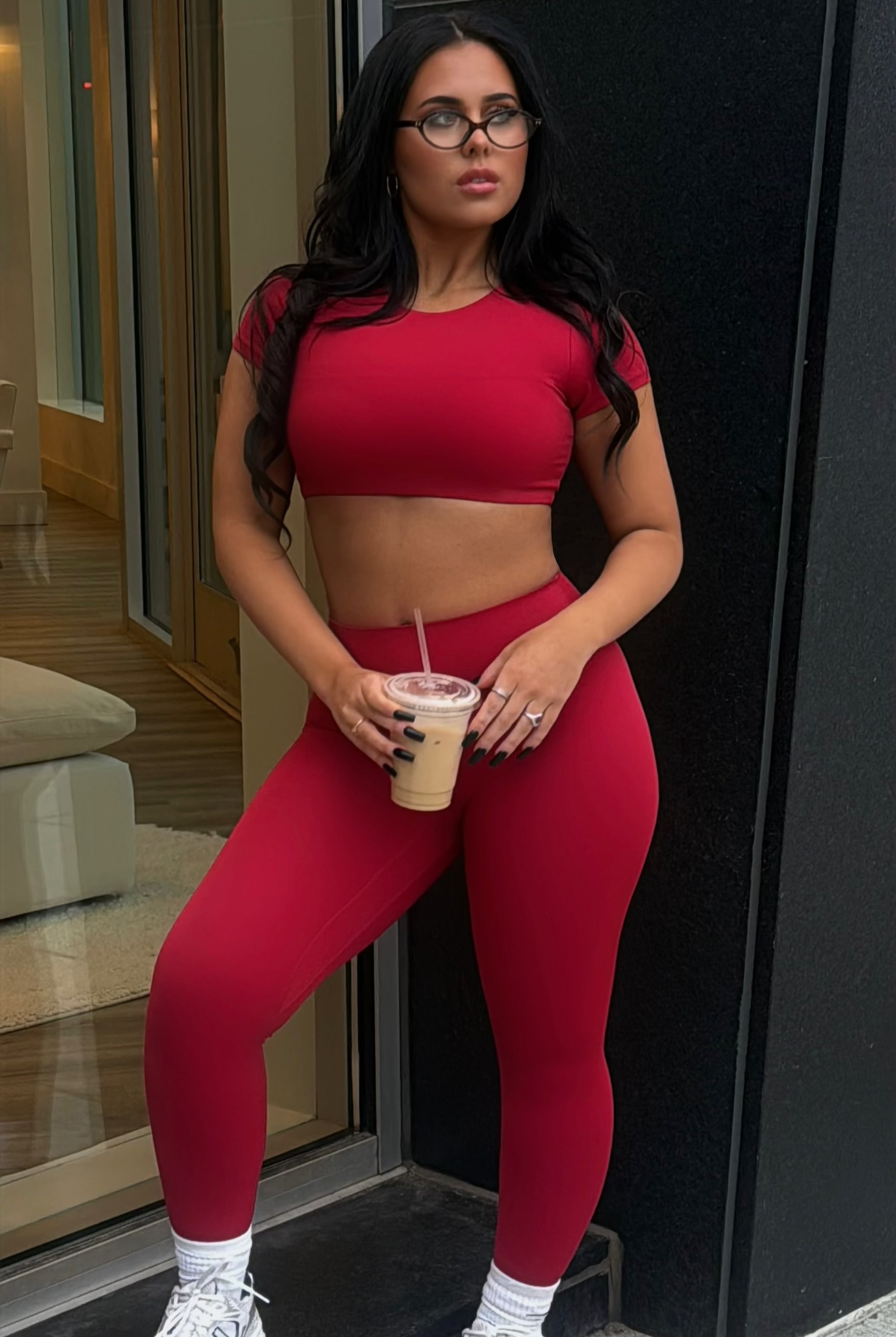 Woman in red Aivvia t-shirt bra and leggings, styled for athleisure with confident, modern flair.