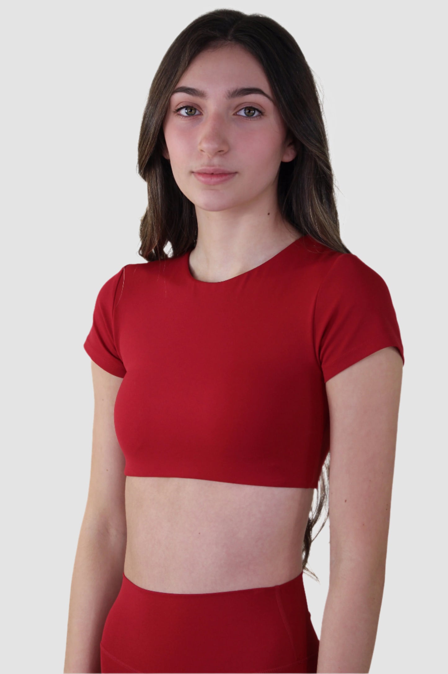 Angled front of Aivvia short-sleeve crop top, ideal for gym workouts or casual wear.