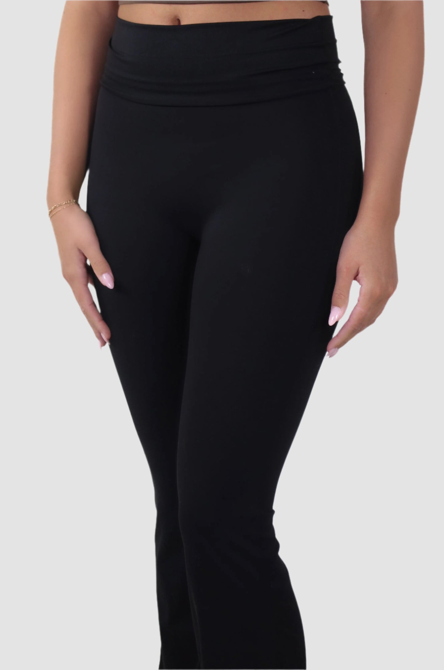 Side view of black Aivvia Athletics flared yoga pants, breathable and stretchy activewear for women.