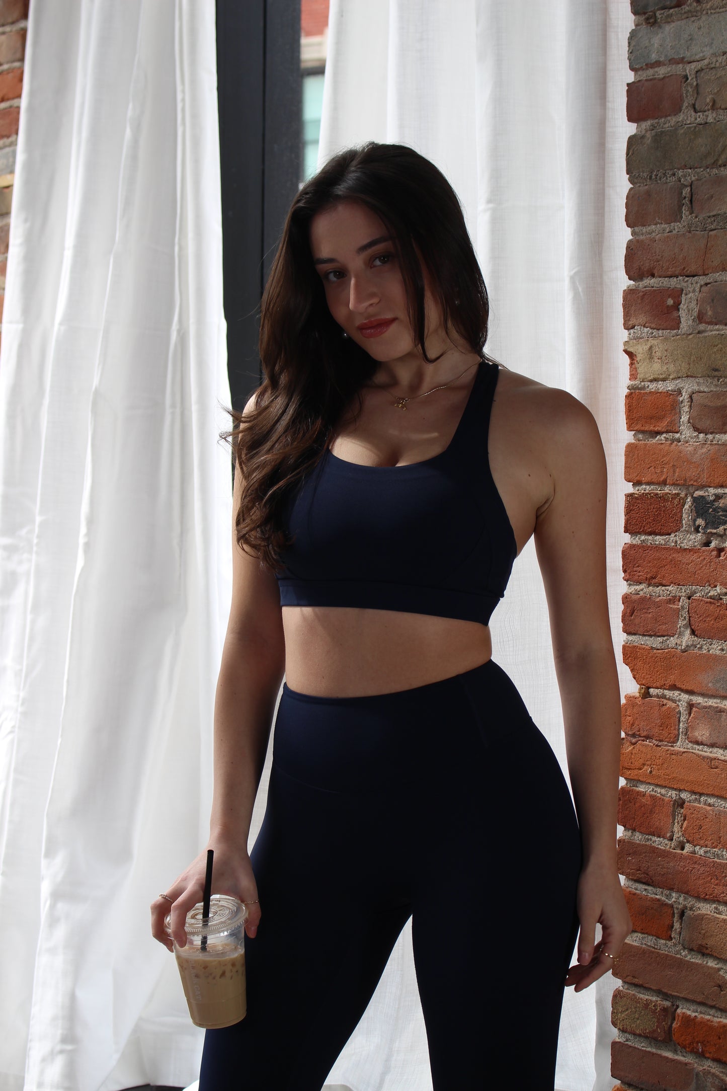 Aivvia Athletics navy sports bra with sleek, supportive design and breathable fabric for versatile athletic performance.
