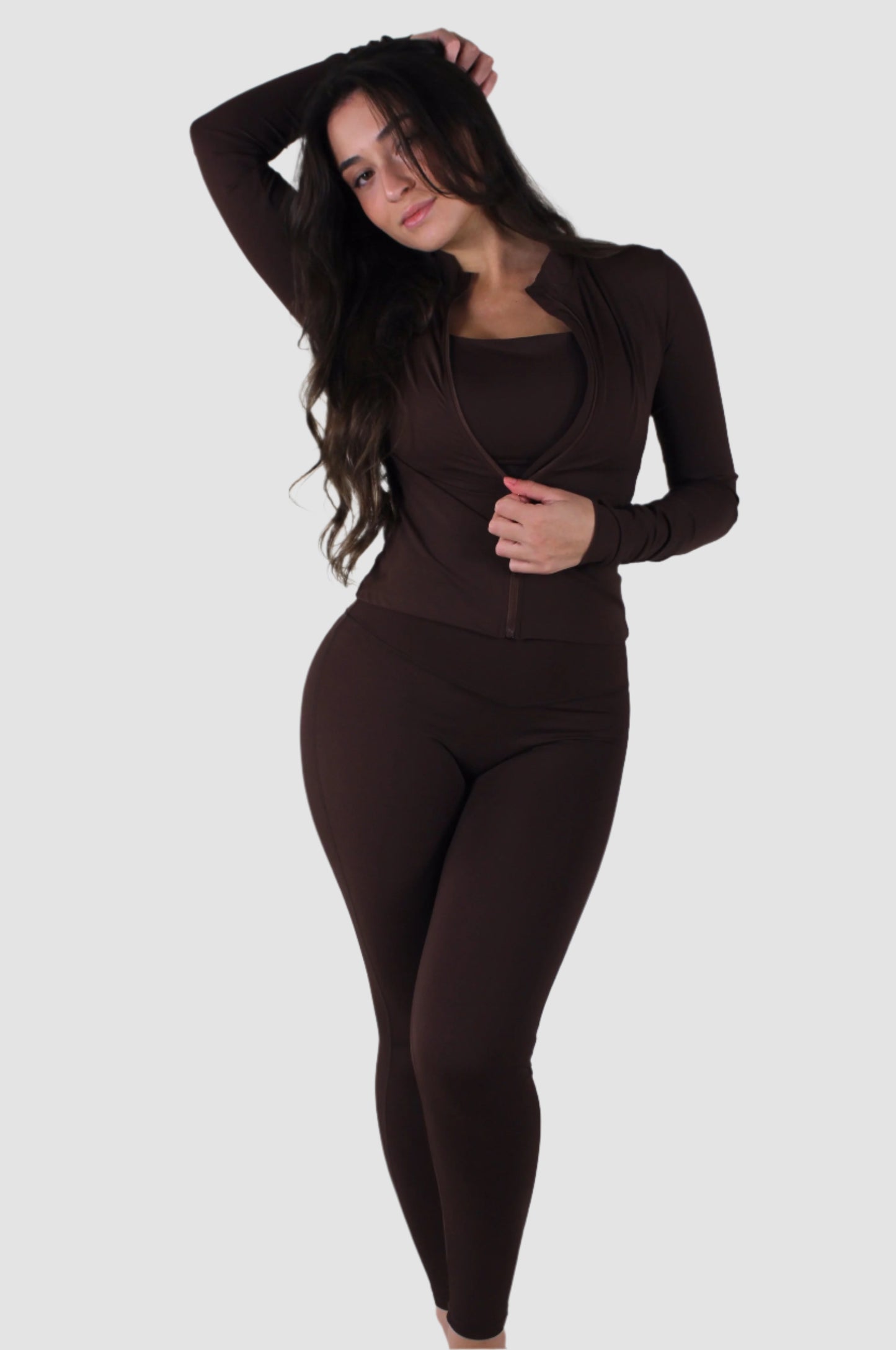 Brown Aivvia Athletics high-waist leggings paired with black long-sleeve crop top, women’s activewear set.