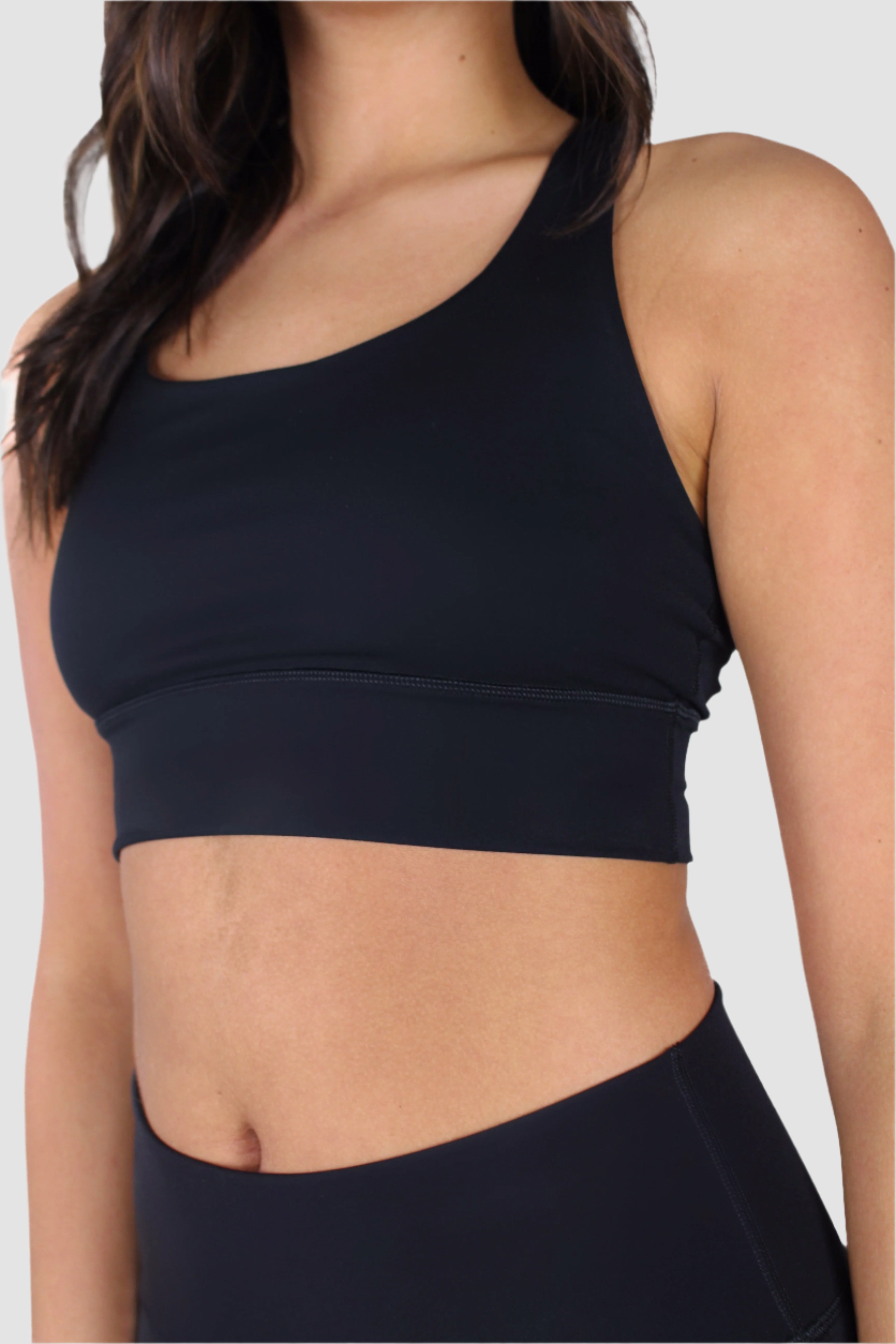 Angled front view of black Aivvia Athletics sports bra with supportive fit and smooth finish.