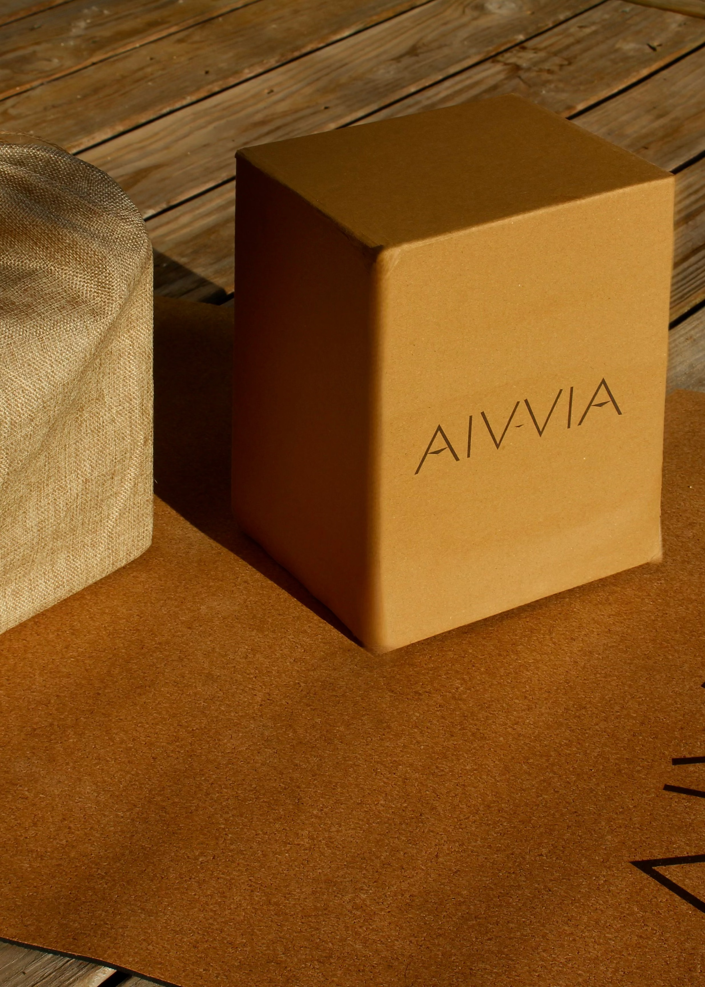 Cork yoga blocks and a drawstring bag displayed on a cork yoga mat.