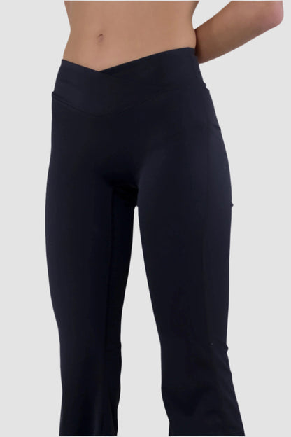 Angled front view of black Aivvia Athletics high-rise flare yoga pants, women’s bootcut fitness bottoms.