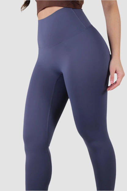 Side view of navy Aivvia Athletics leggings, women’s athletic tights with sleek fit for performance and comfort.
