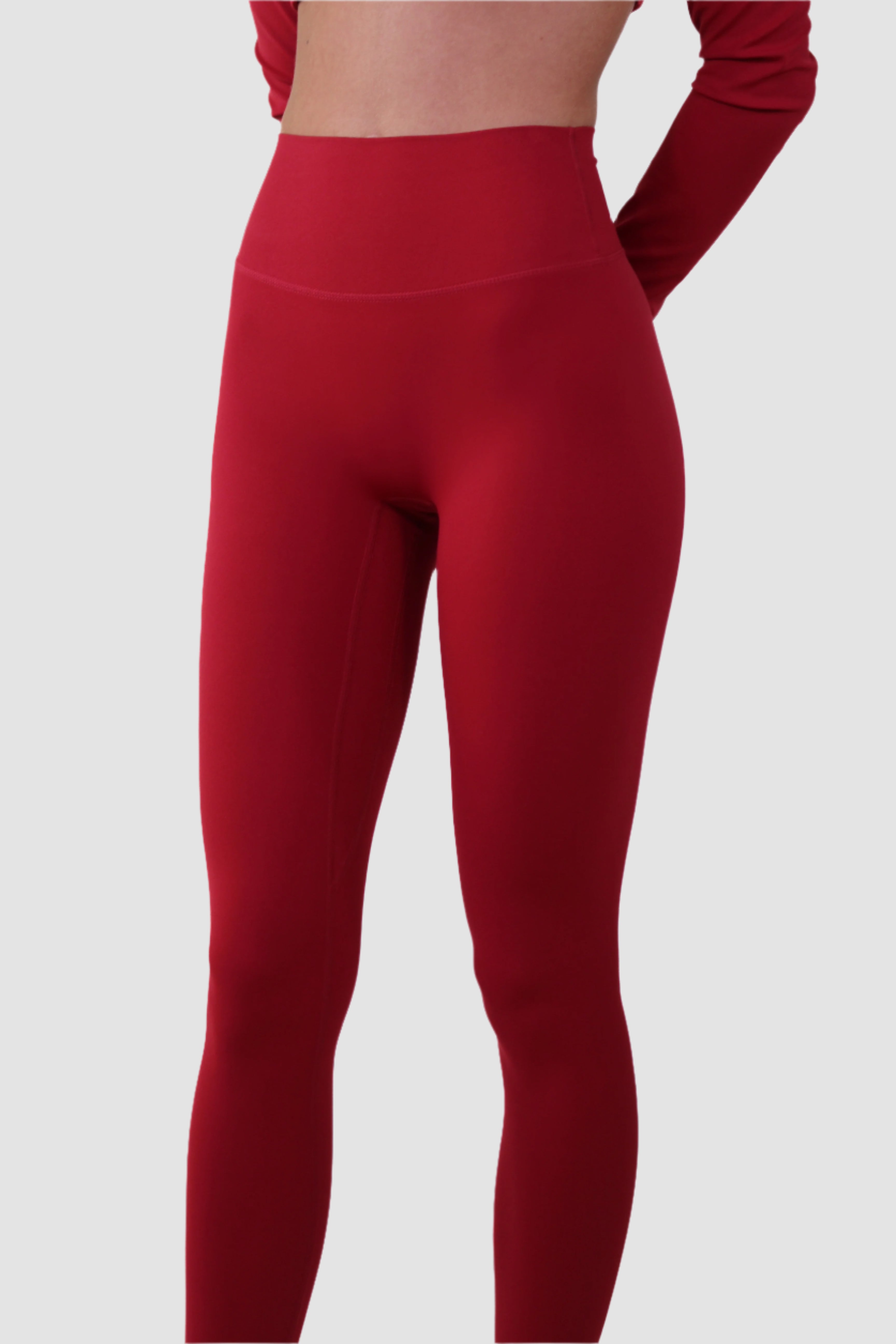 Side view of red Aivvia sports bra, sleek compression fit ideal for running and fitness training.
