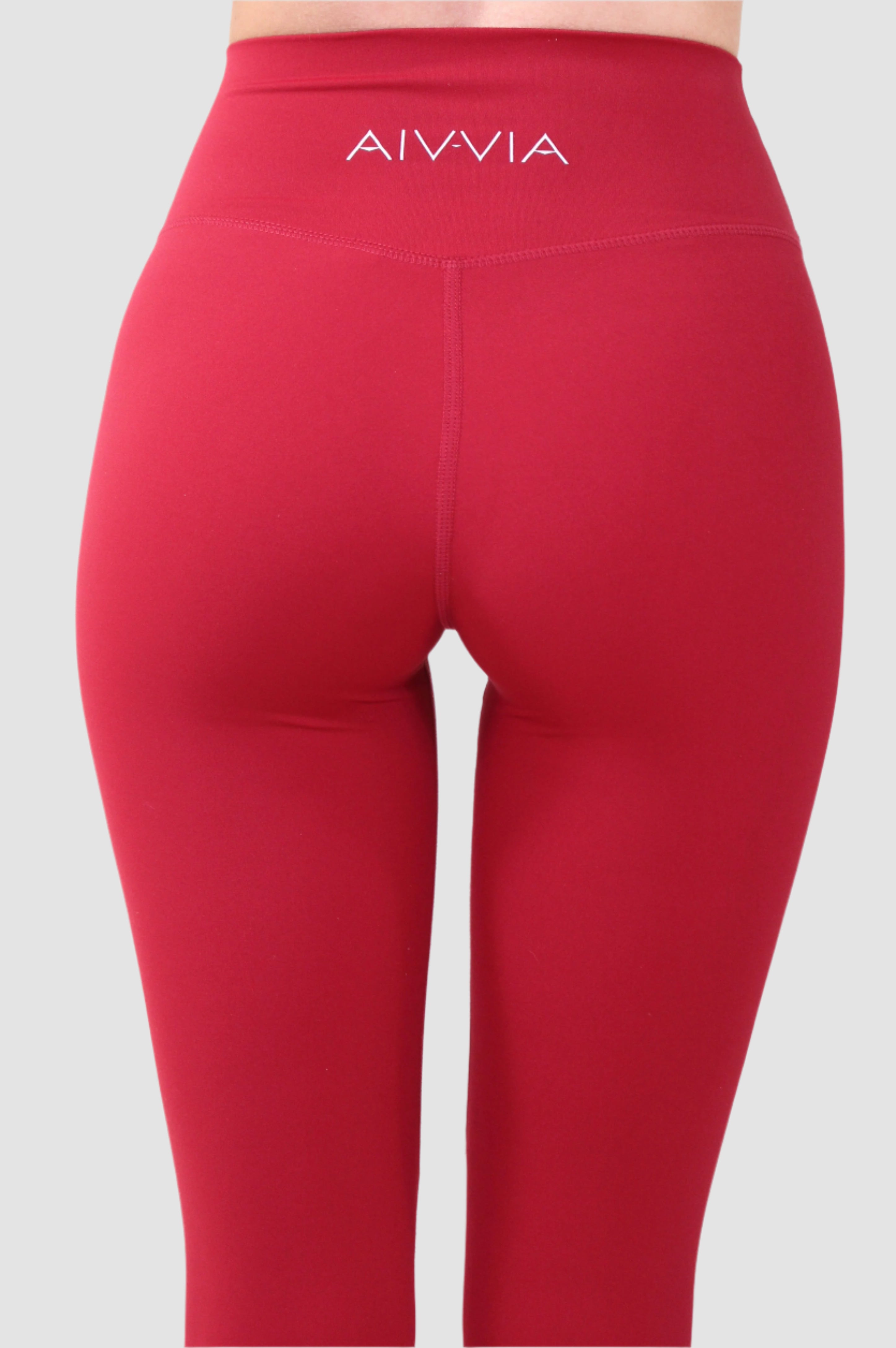 Angled back of Aivvia sports bra highlighting logo and flattering athletic contour.