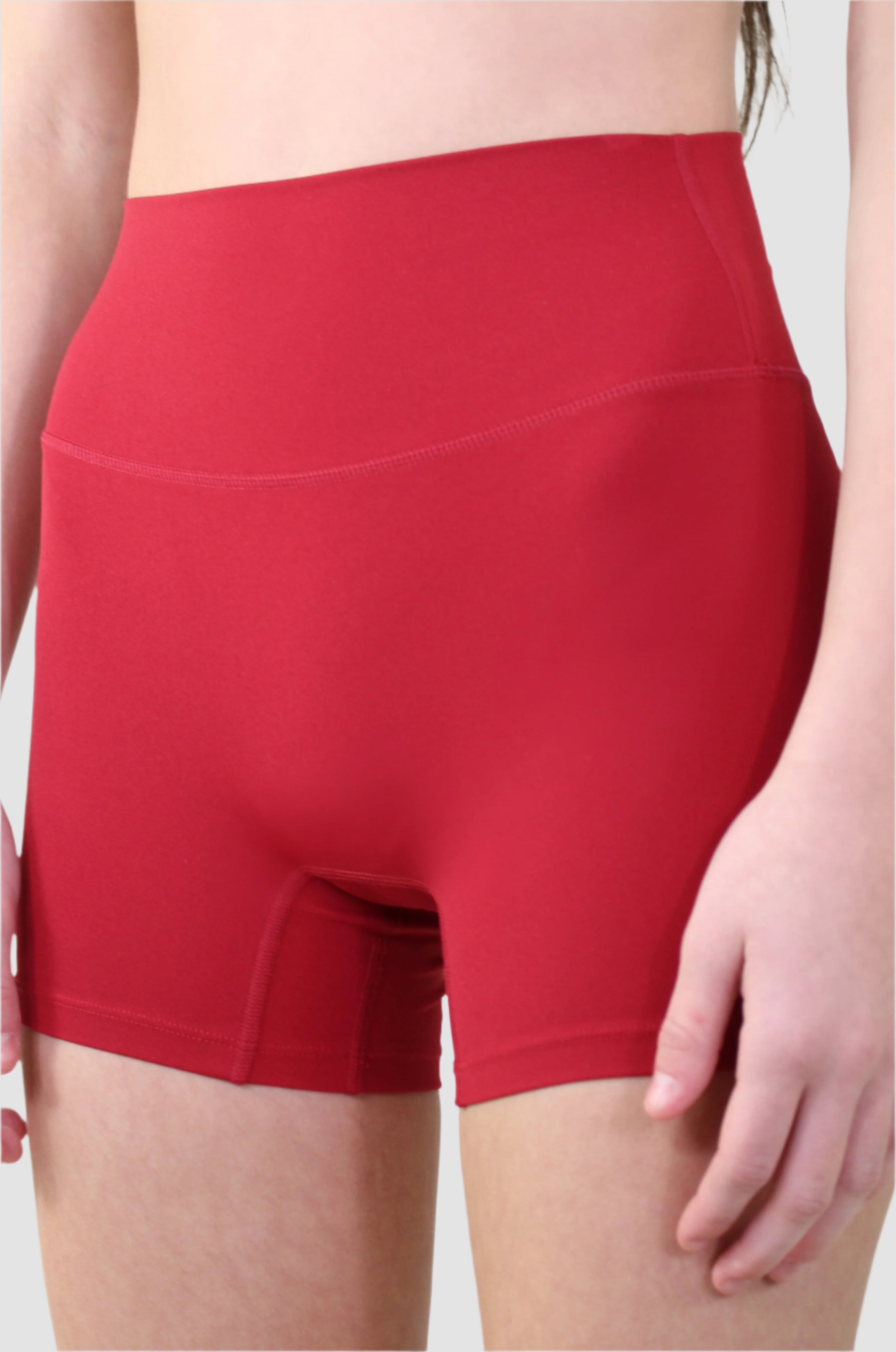 Angled front view of red athletic shorts by Aivvia, seamless fit for mobility and comfort.