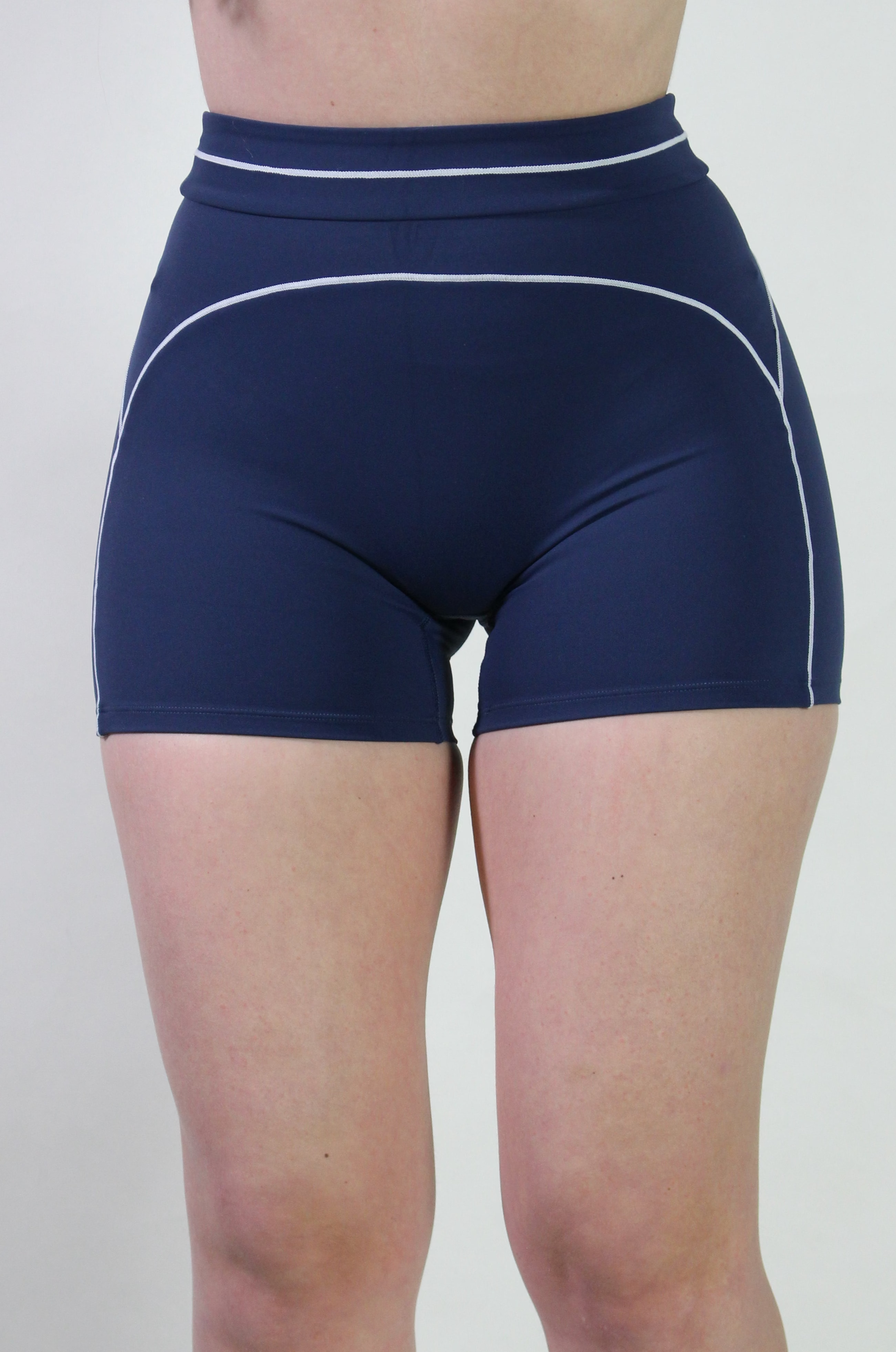 Front view of the Midnight Navy Sculpt Shorts showing the secure waistband and mid-thigh length coverage.