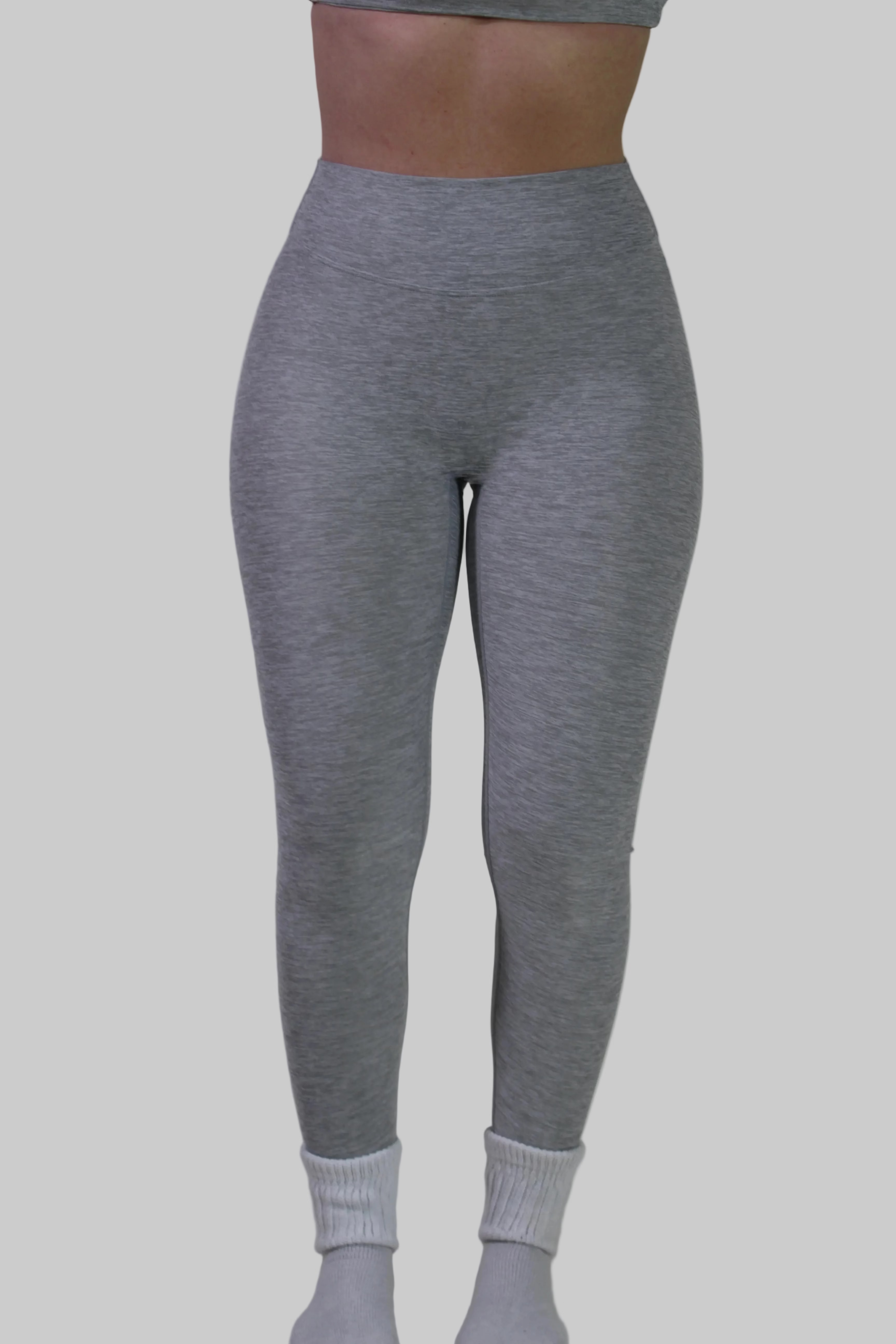 Full front view of Aivvia Athletics light gray high-waisted leggings, showing smooth compressive fit and secure waistband.