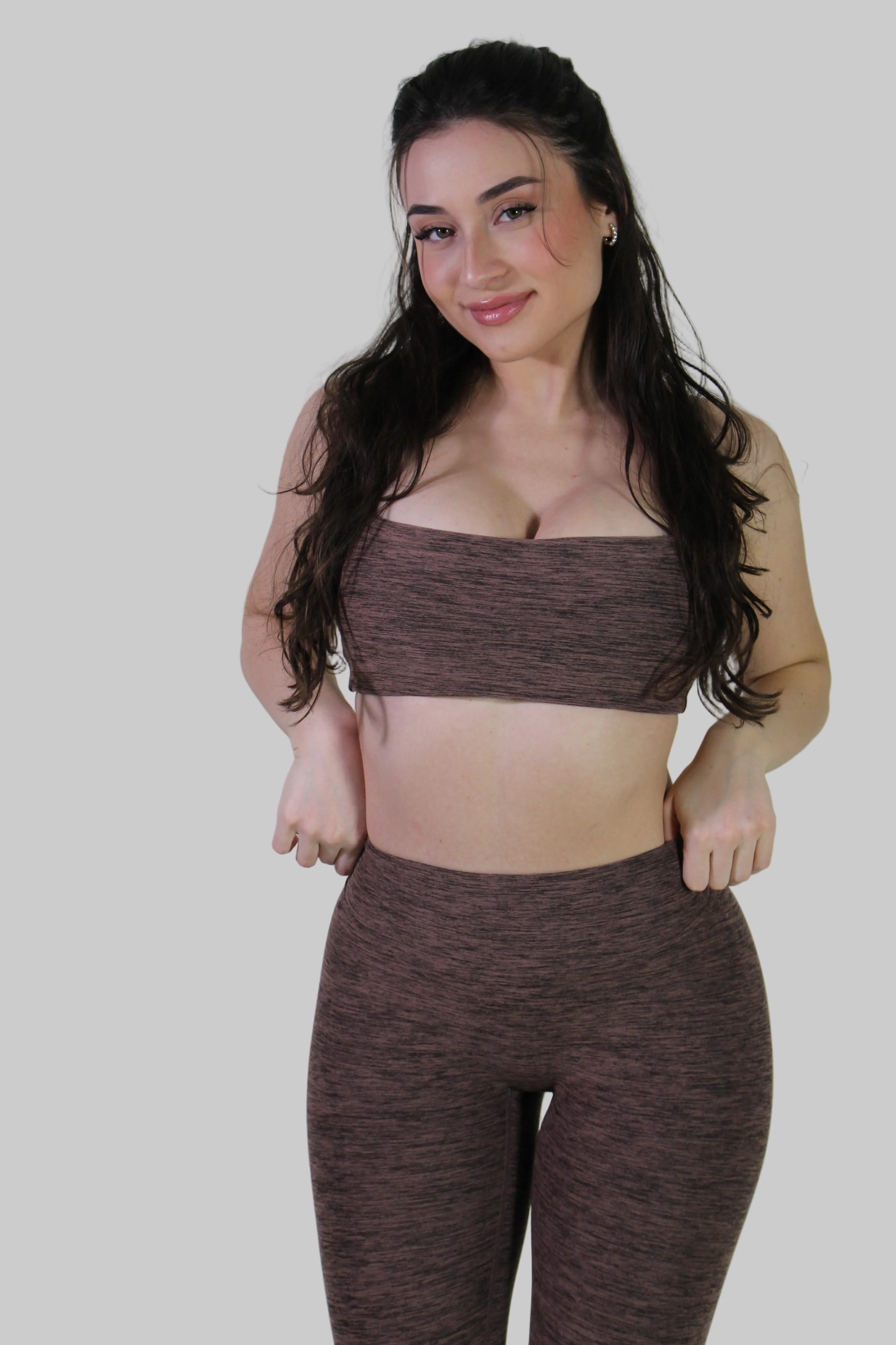 Front view of the Aivvia Athletics Marl Espresso square neck sports top, featuring textured heathered fabric, longline fit, and supportive underband for women’s gym workouts and activewear outfits.