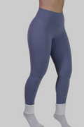 Close-up of Aivvia Athletics squat-proof purple blue workout leggings fabric, featuring matte moisture-wicking performance material, reinforced stitching, and four-way stretch for intense gym training and yoga sessions.
