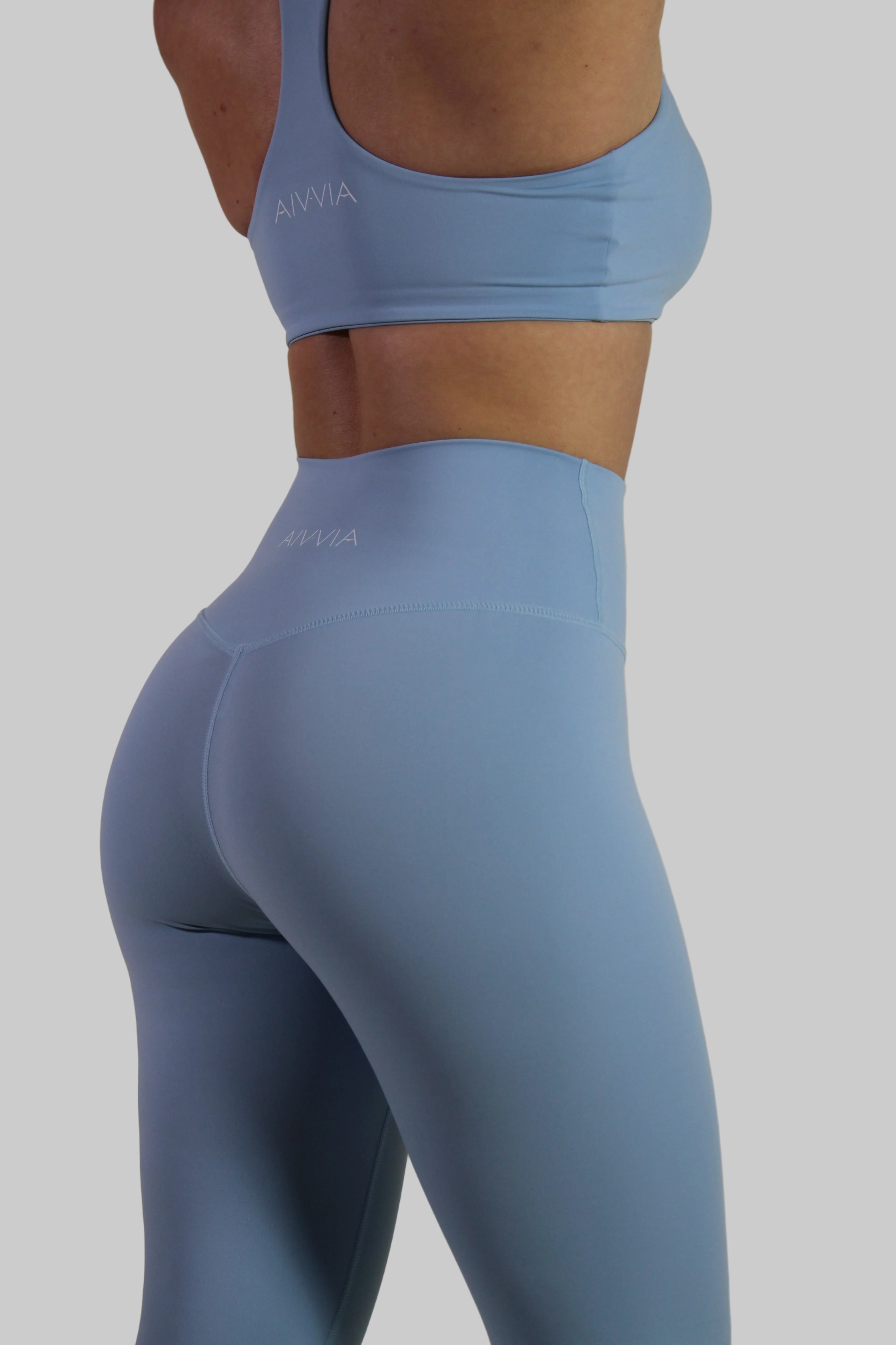 Side profile of Aivvia Athletics baby blue leggings, highlighting compressive second-skin fit and squat-proof activewear fabric.