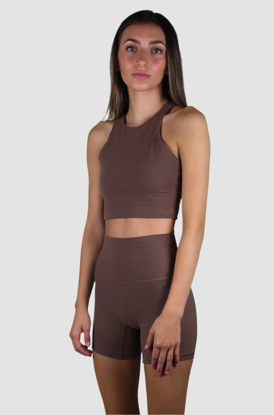 Front view of a chocolate brown activewear set featuring a high-neck cropped tank top and matching high-waisted biker shorts.