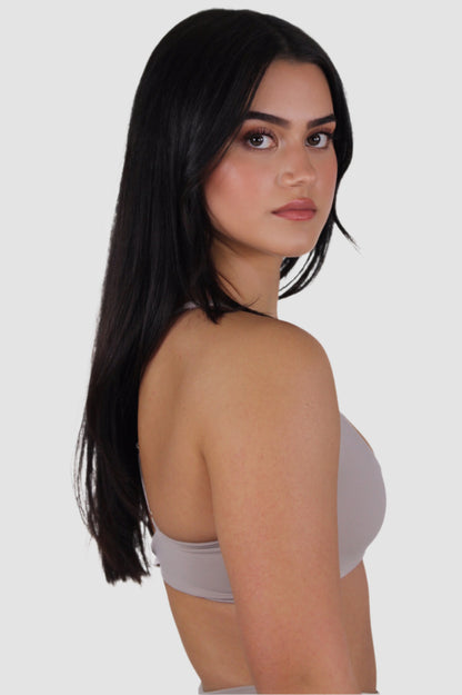 Side profile of light taupe Aivvia Athletics sports bra showing smooth, supportive fit.