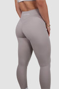 Back view of taupe Aivvia Athletics leggings; high-waisted, body-contouring fit for style and performance.