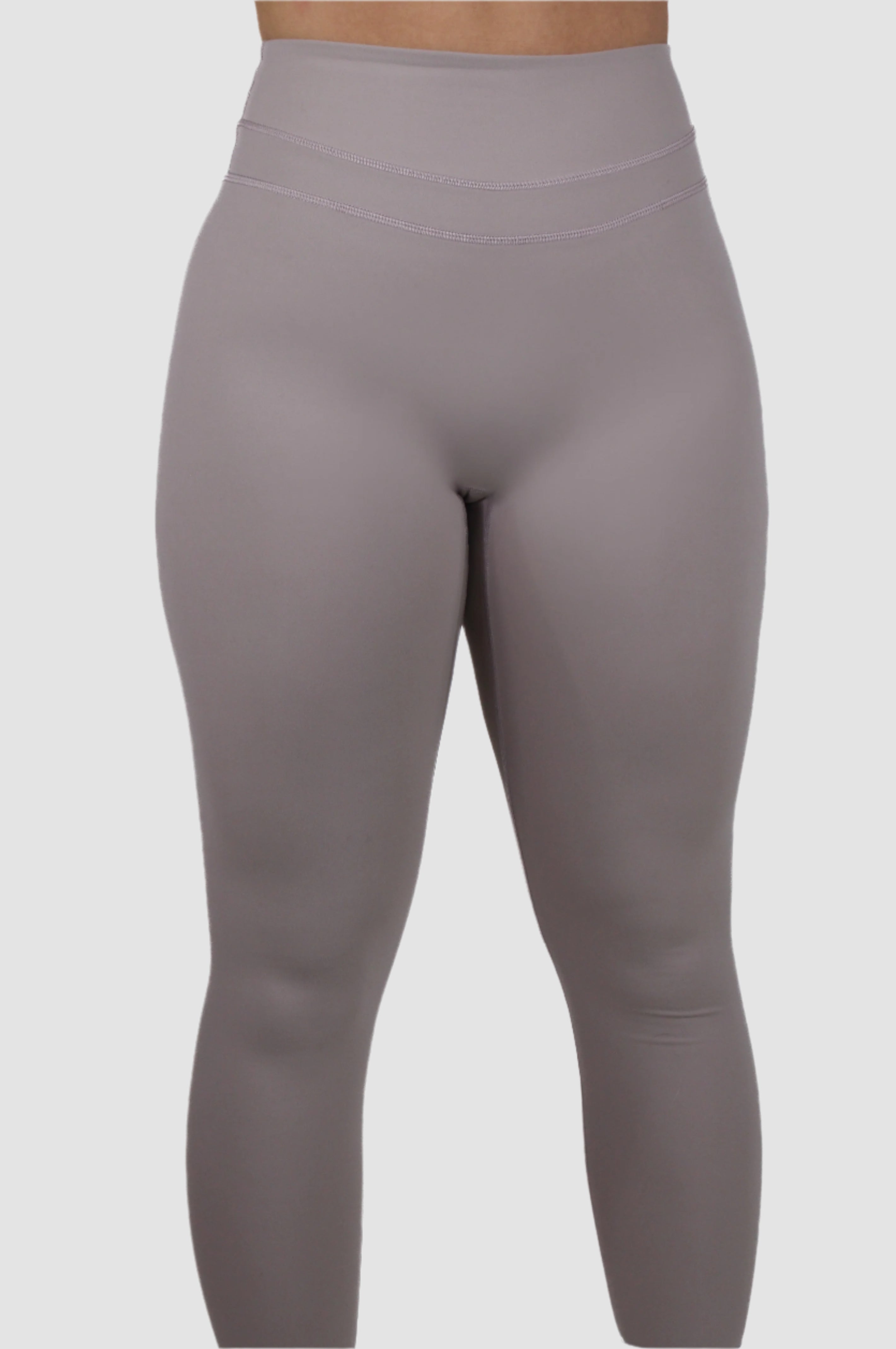 Front view of light taupe Aivvia Athletics high-waisted full-length leggings.