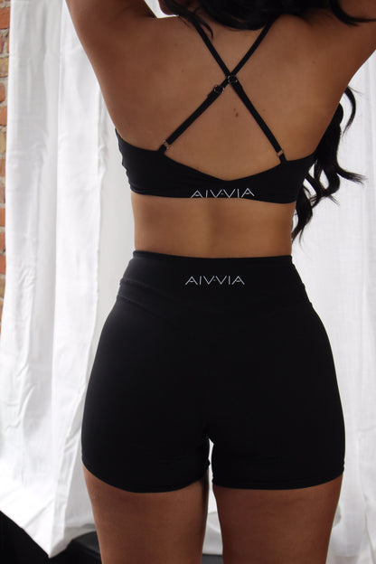Back view of black Aivvia Athletics shorts with logo detail; sculpting, athletic fit for performance and style.

