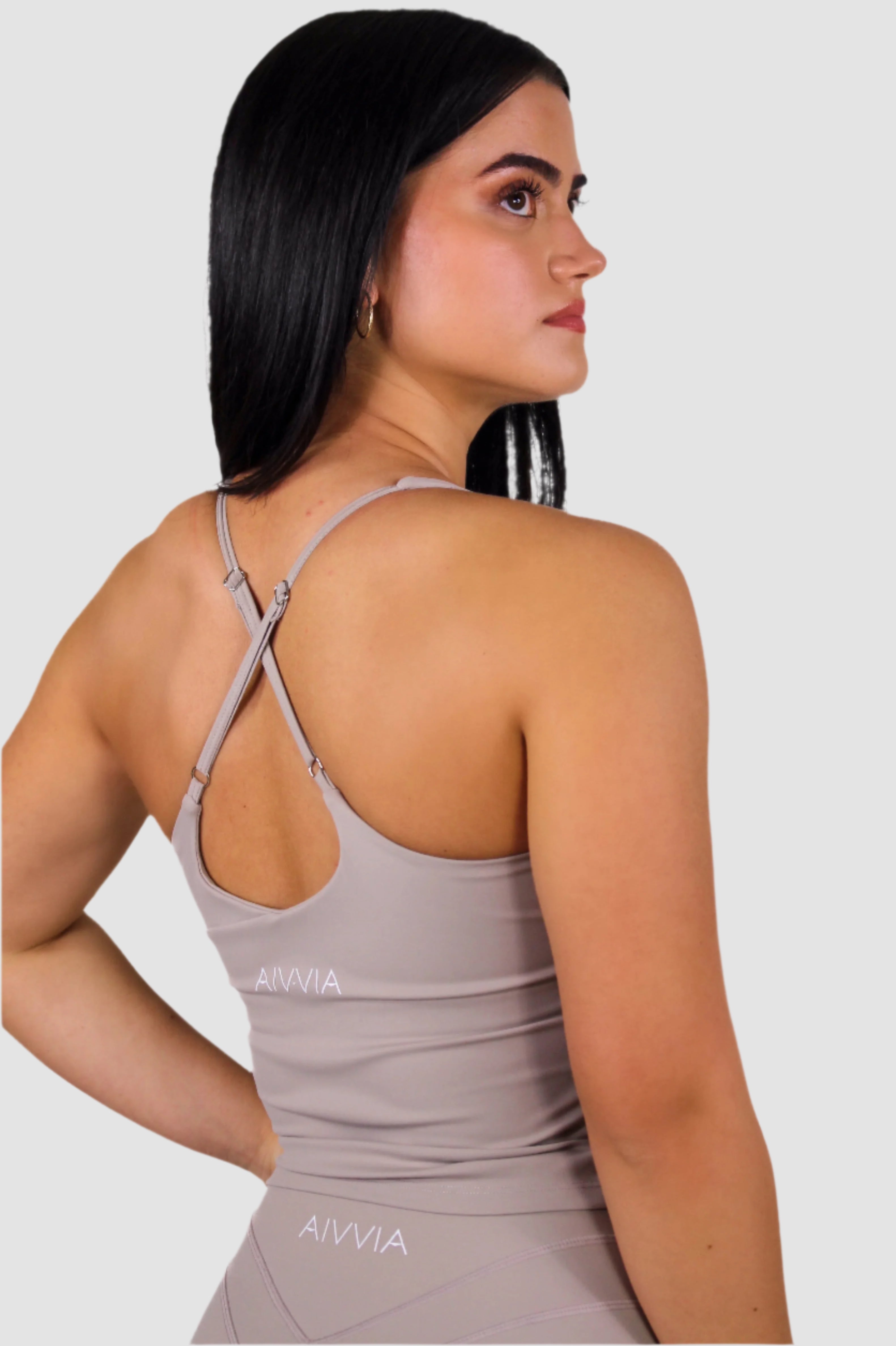 Back view of taupe Aivvia Athletics tank top; minimal design for everyday wear and fitness performance.