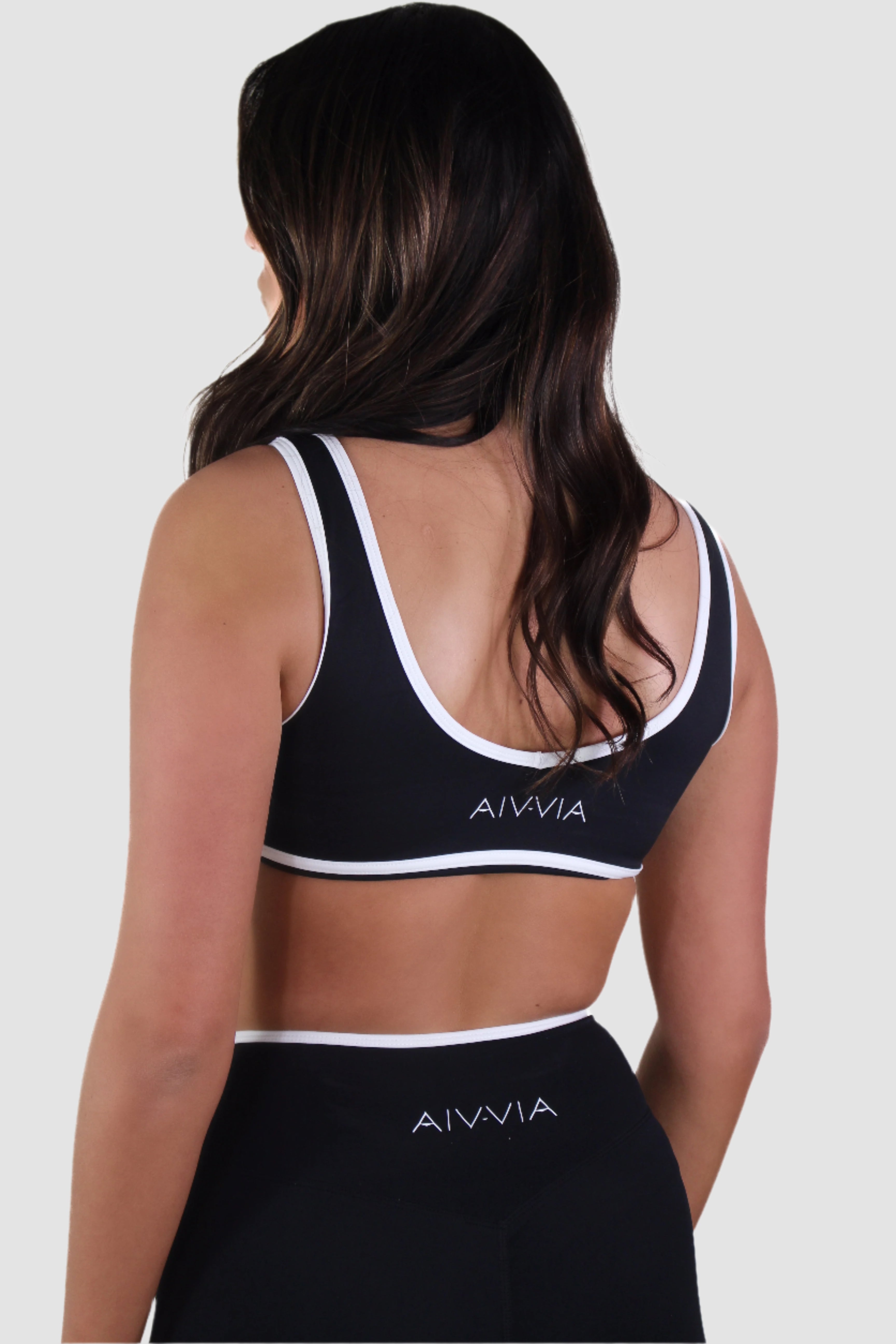 Back view of slate blue Aivvia Athletics sports bra, soft and lightweight women’s activewear top.