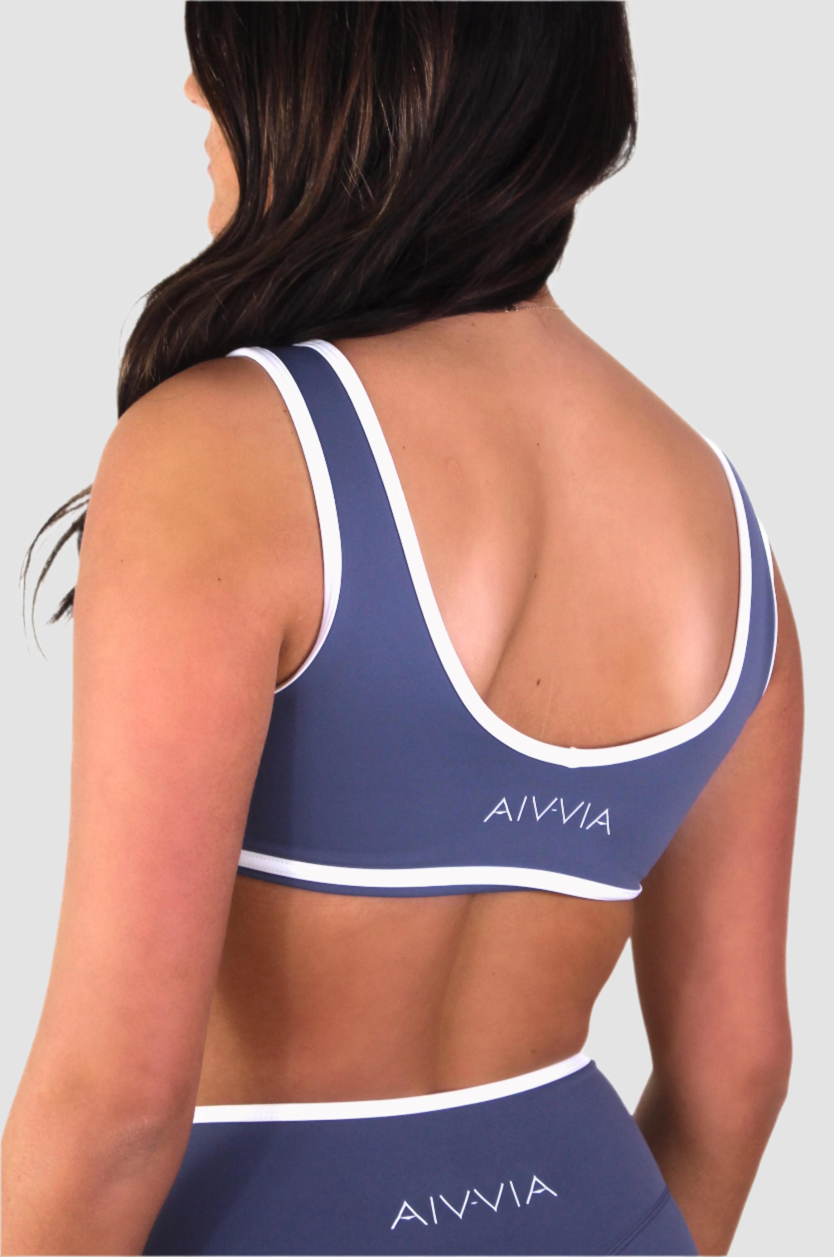 Back view of black Aivvia Athletics sports bra, racerback design for active movement.