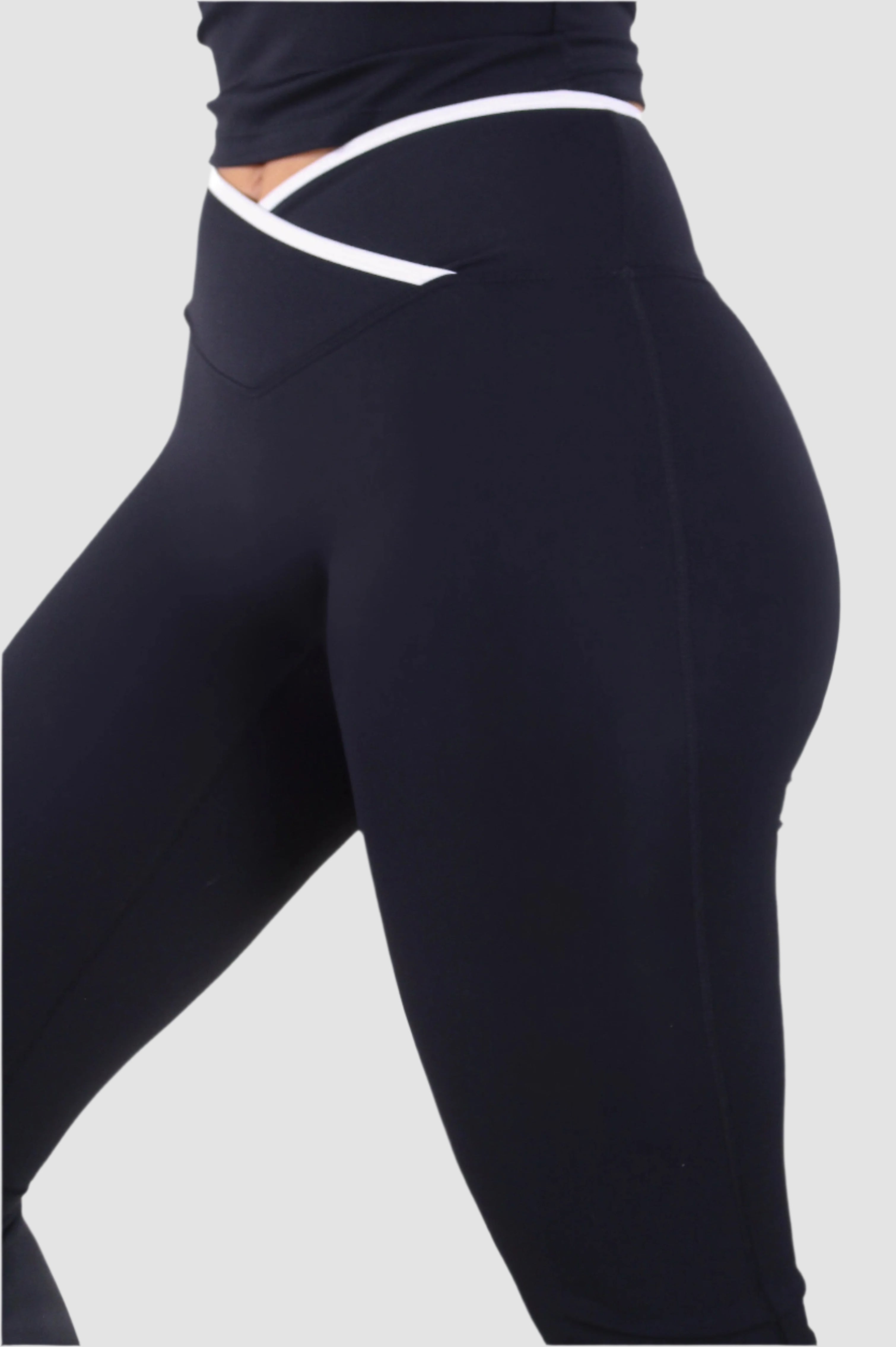 Close-up side view of black Aivvia Athletics yoga pants, breathable second-skin athletic fabric.
