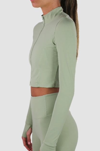 Light sage green Aivvia Athletics cropped athletic jacket with slim fit and long sleeves.