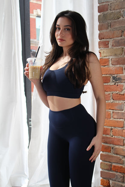 Aivvia Athletics navy high-rise leggings with sculpted waistband for secure fit and flattering silhouette.