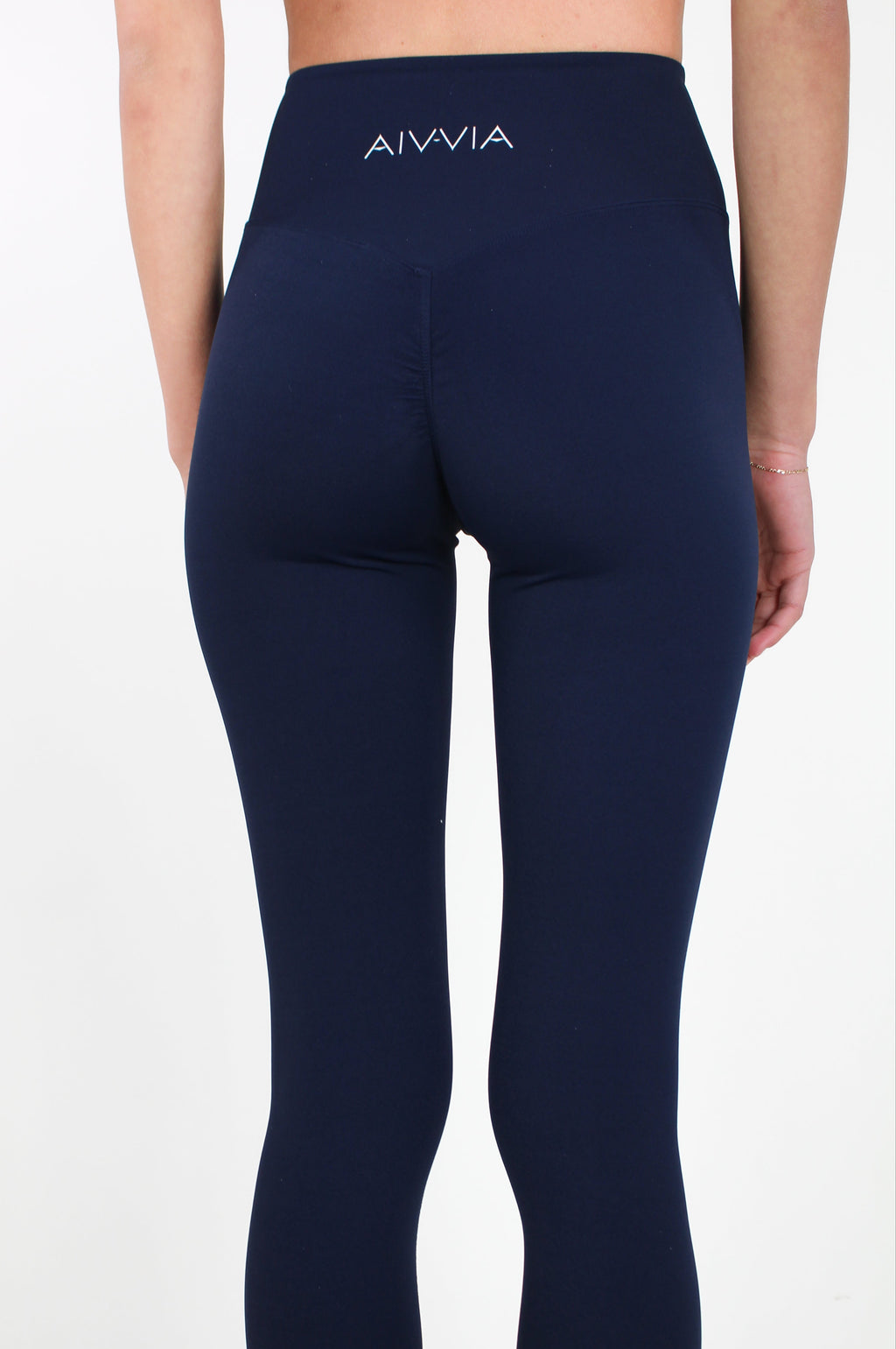 Back view of Aivvia Athletics navy leggings with contour seams and high-rise fit for workout and casual wear.