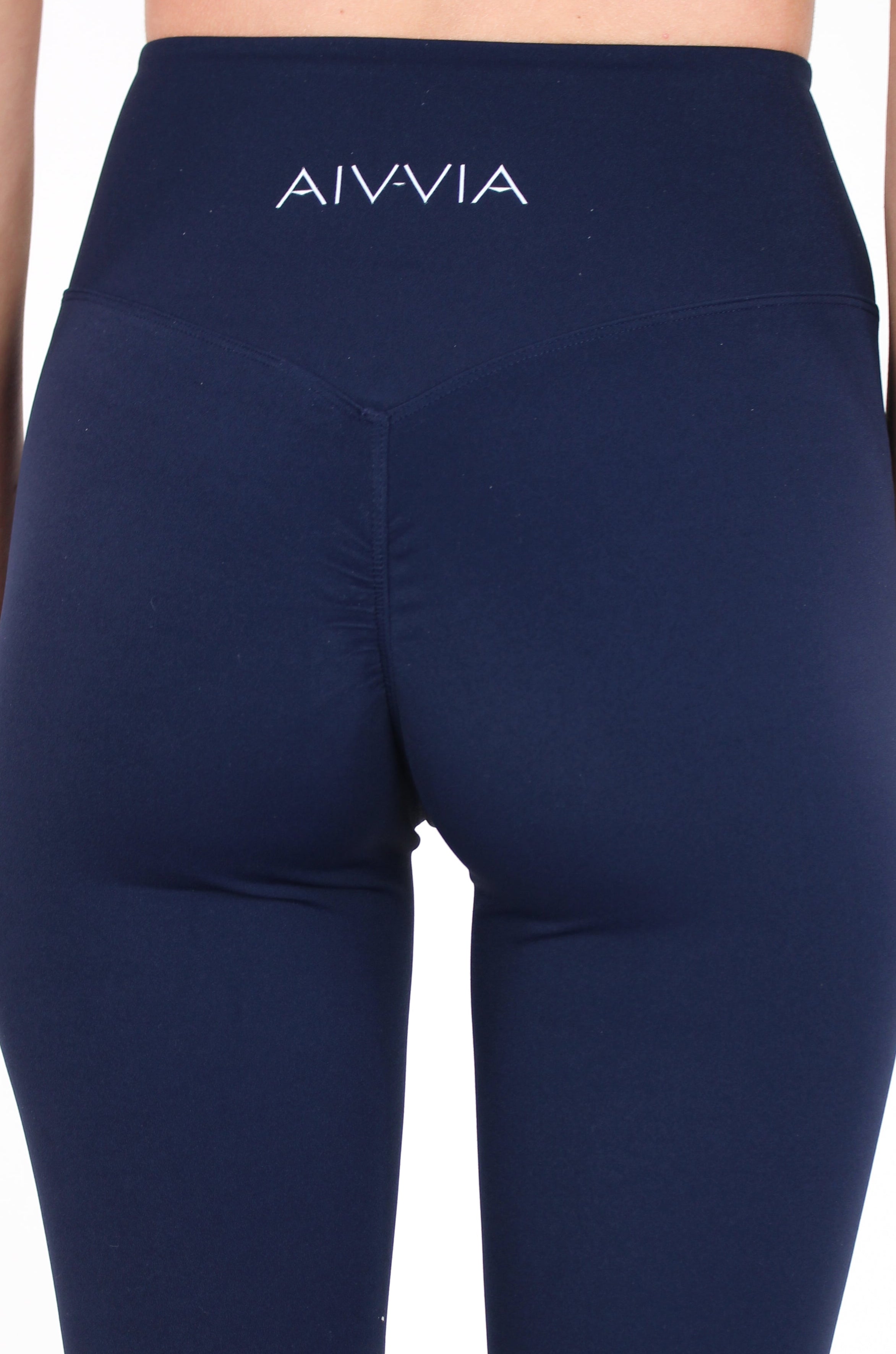 Close-up back view of Aivvia Athletics navy leggings with contour seams and high-rise fit for workout and casual wear.