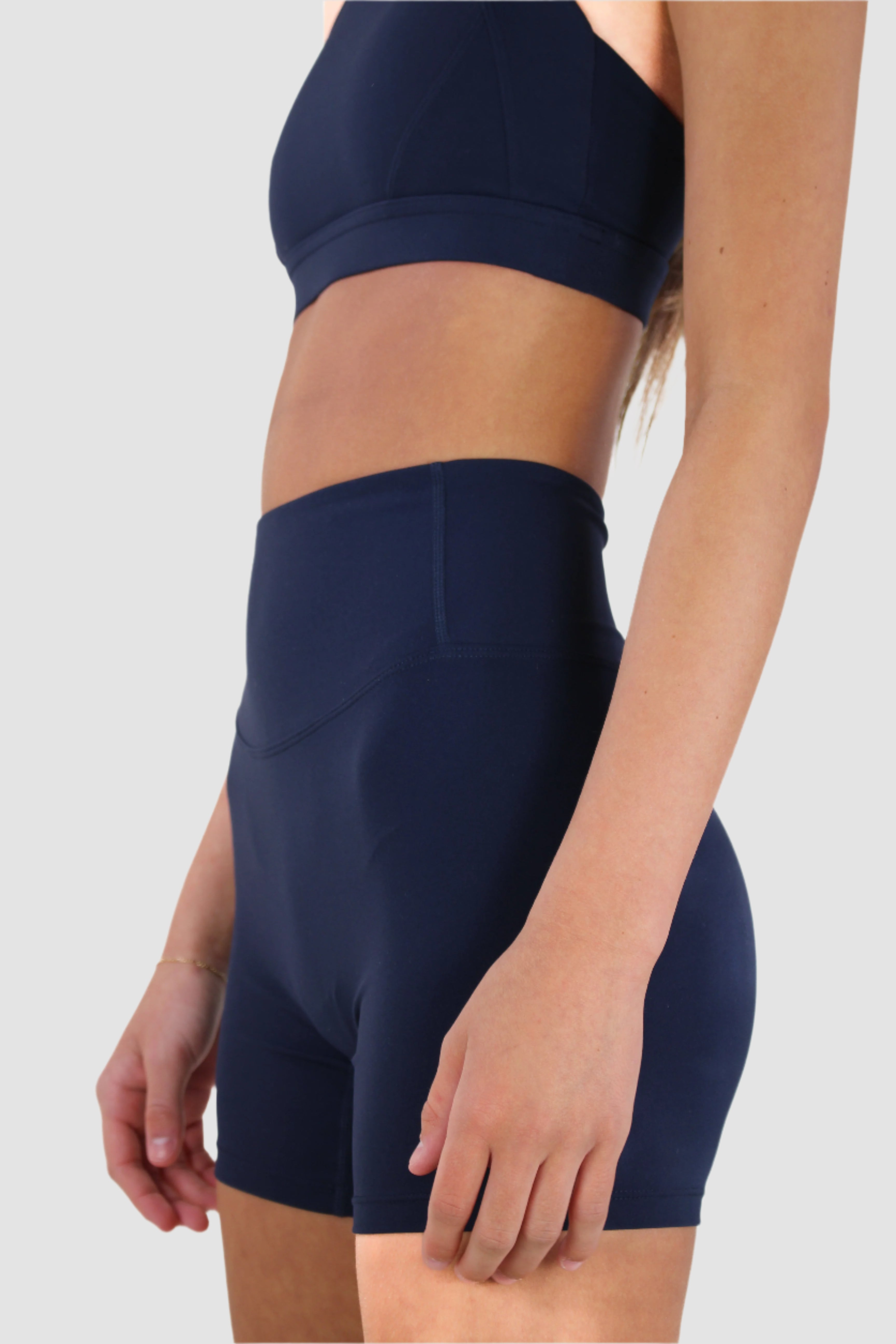 Navy Aivvia Athletics high-waisted seamless shorts with smooth finish and side panel detail.