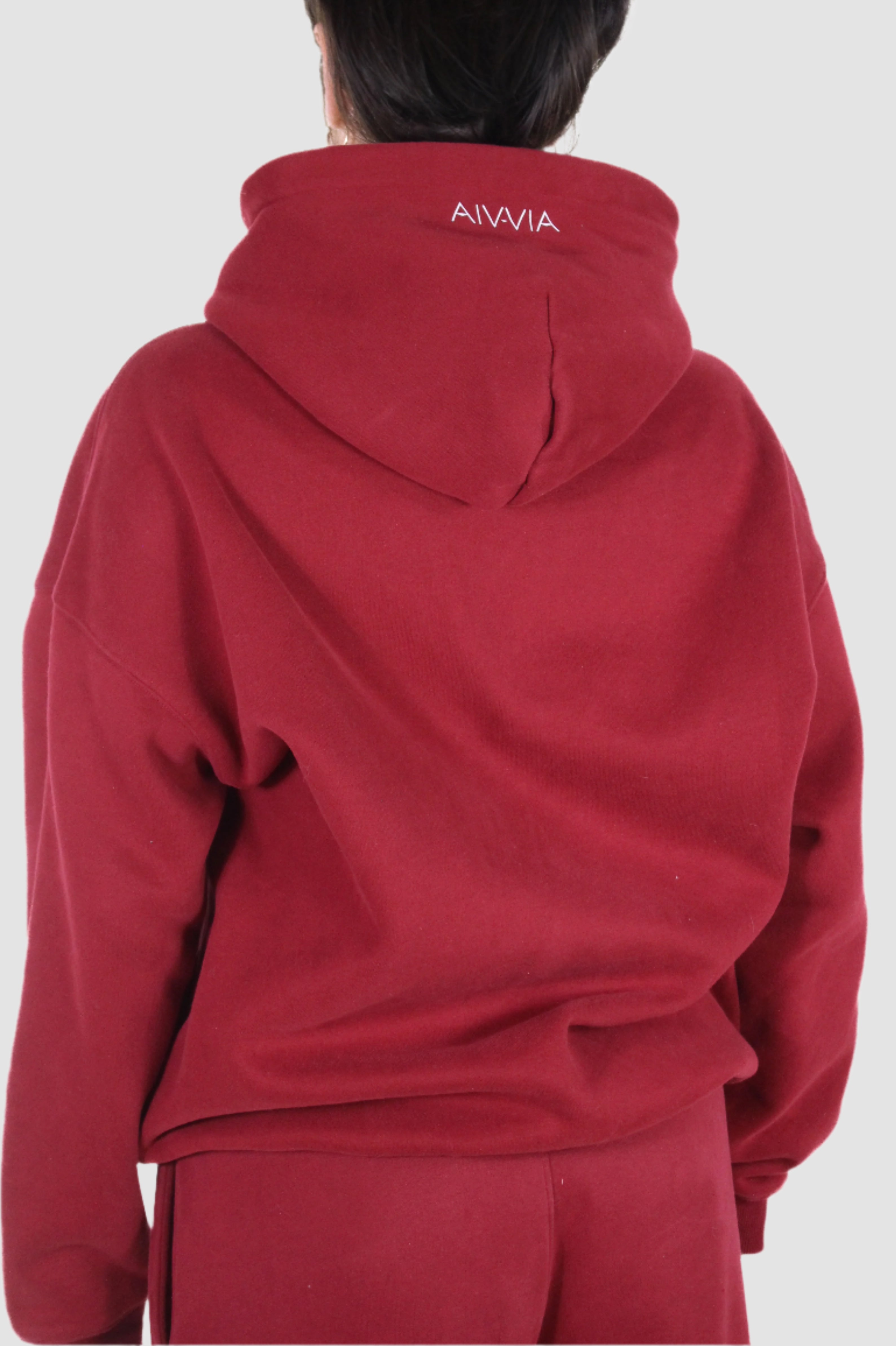 Back view of Aivvia Athletics red hoodie, comfortable athletic pullover for women.