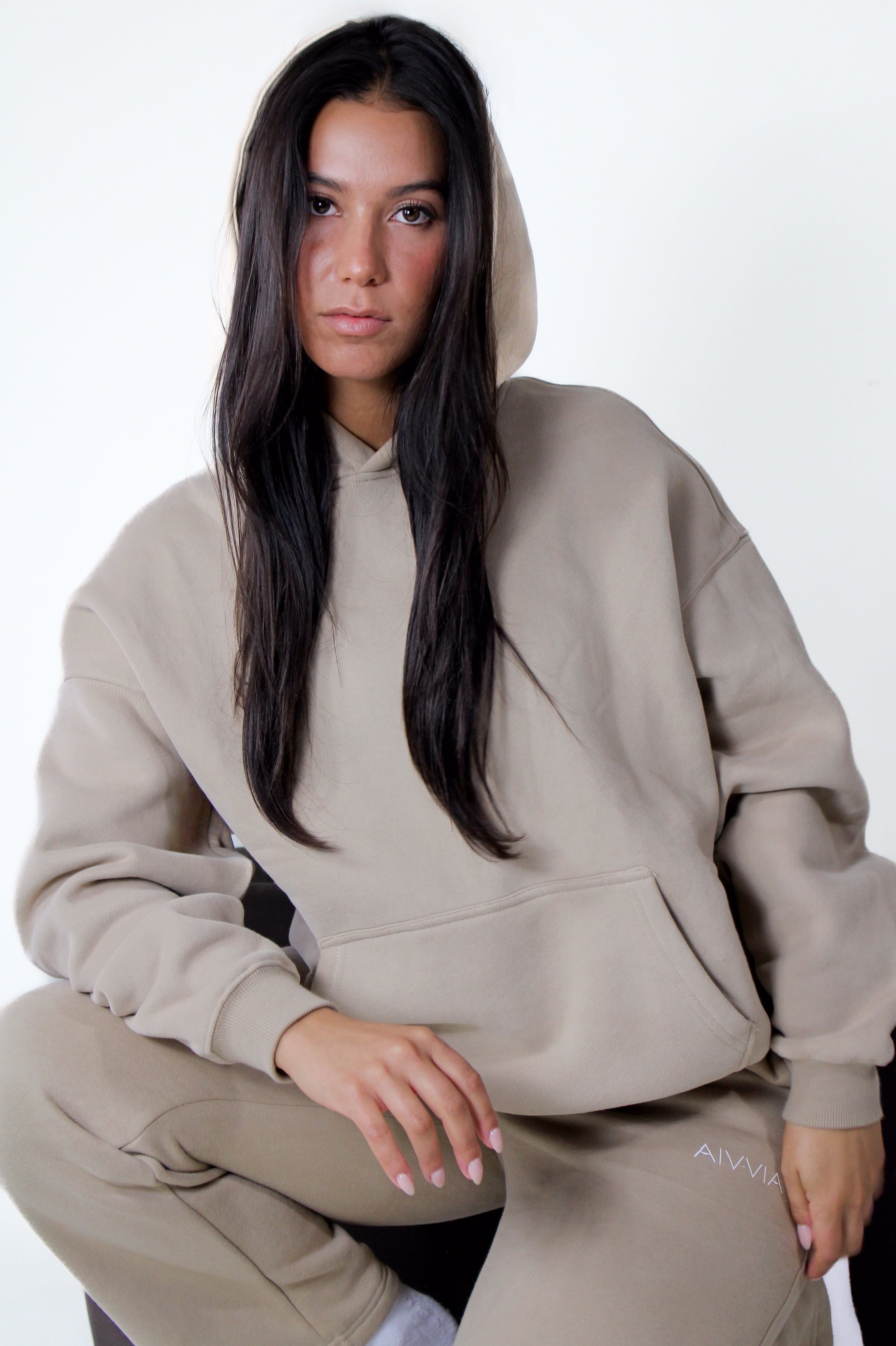 Beige Aivvia Athletics hoodie, relaxed women’s athletic sweatshirt for cozy and stylish everyday wear.