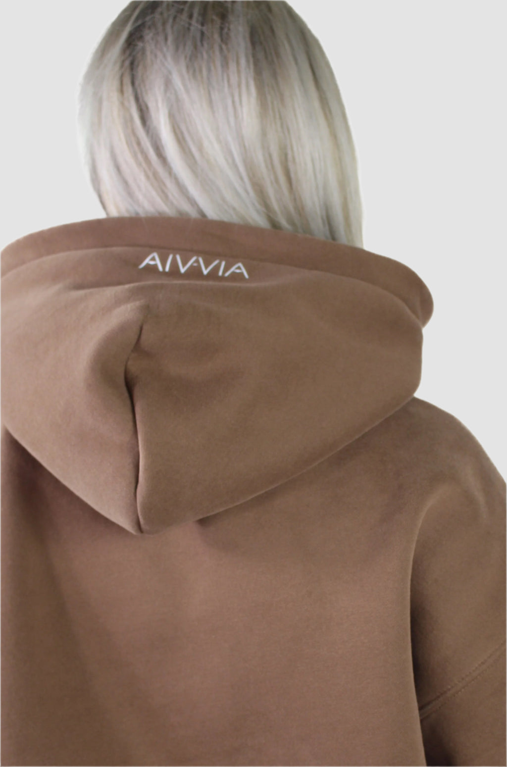 Back view of brown Aivvia Athletics hoodie with logo on hood, premium women’s athleticwear.


