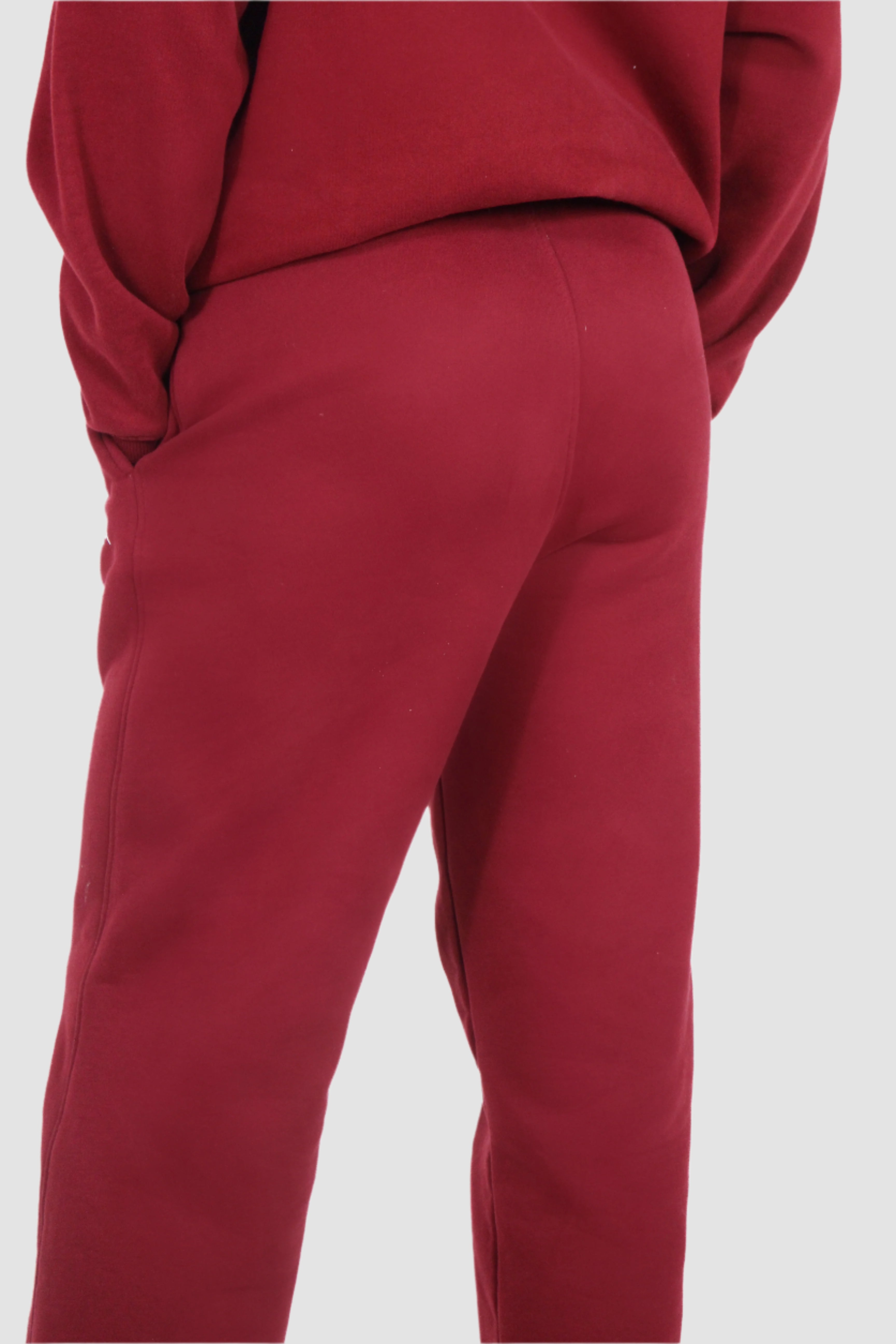 Back view of Aivvia Athletics women's burgundy sweatpants, relaxed fit, premium comfort athletic style.