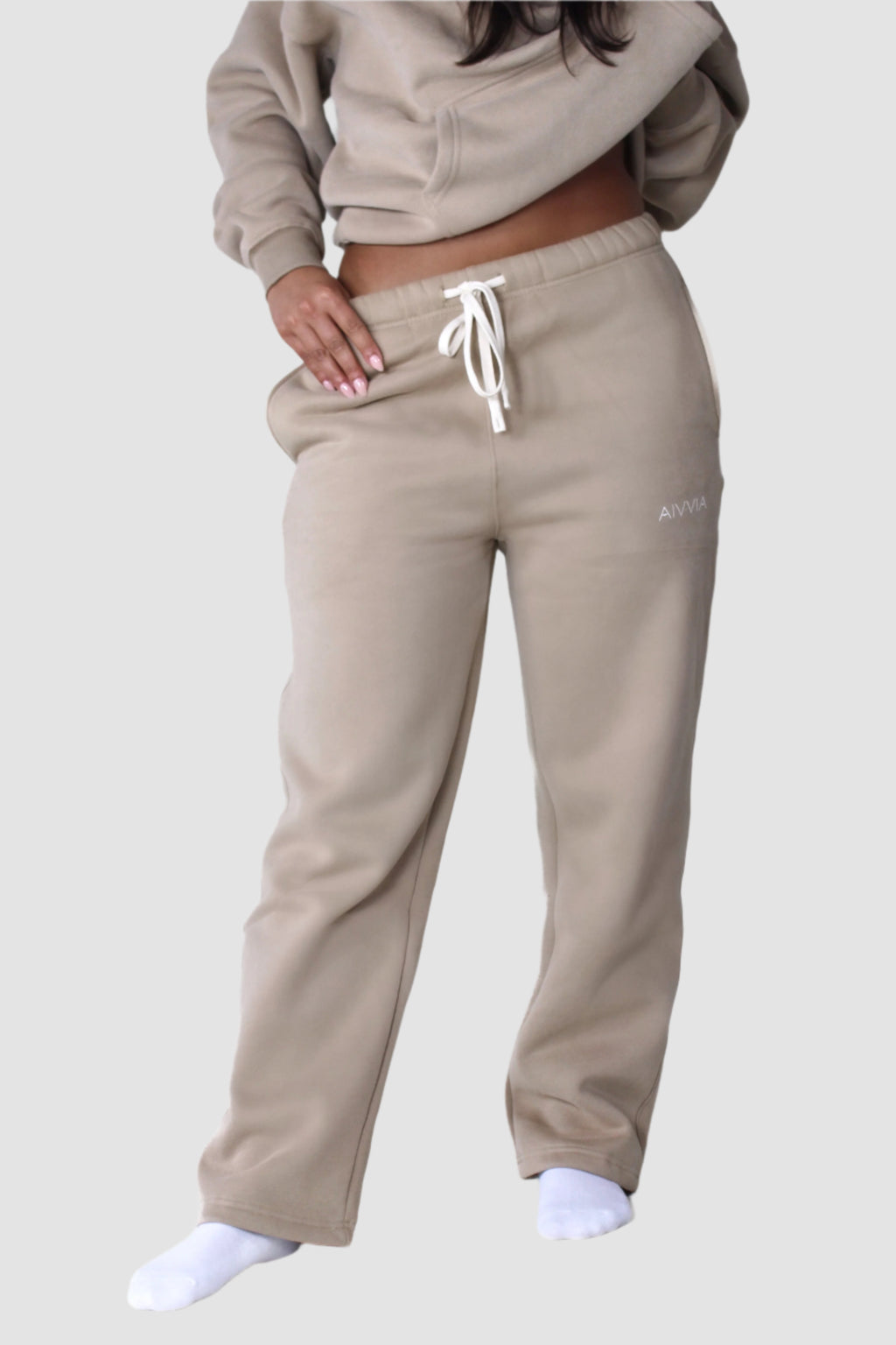 Aivvia Athletics beige women’s sweatpants, soft fleece joggers with drawstring waist for activewear comfort.