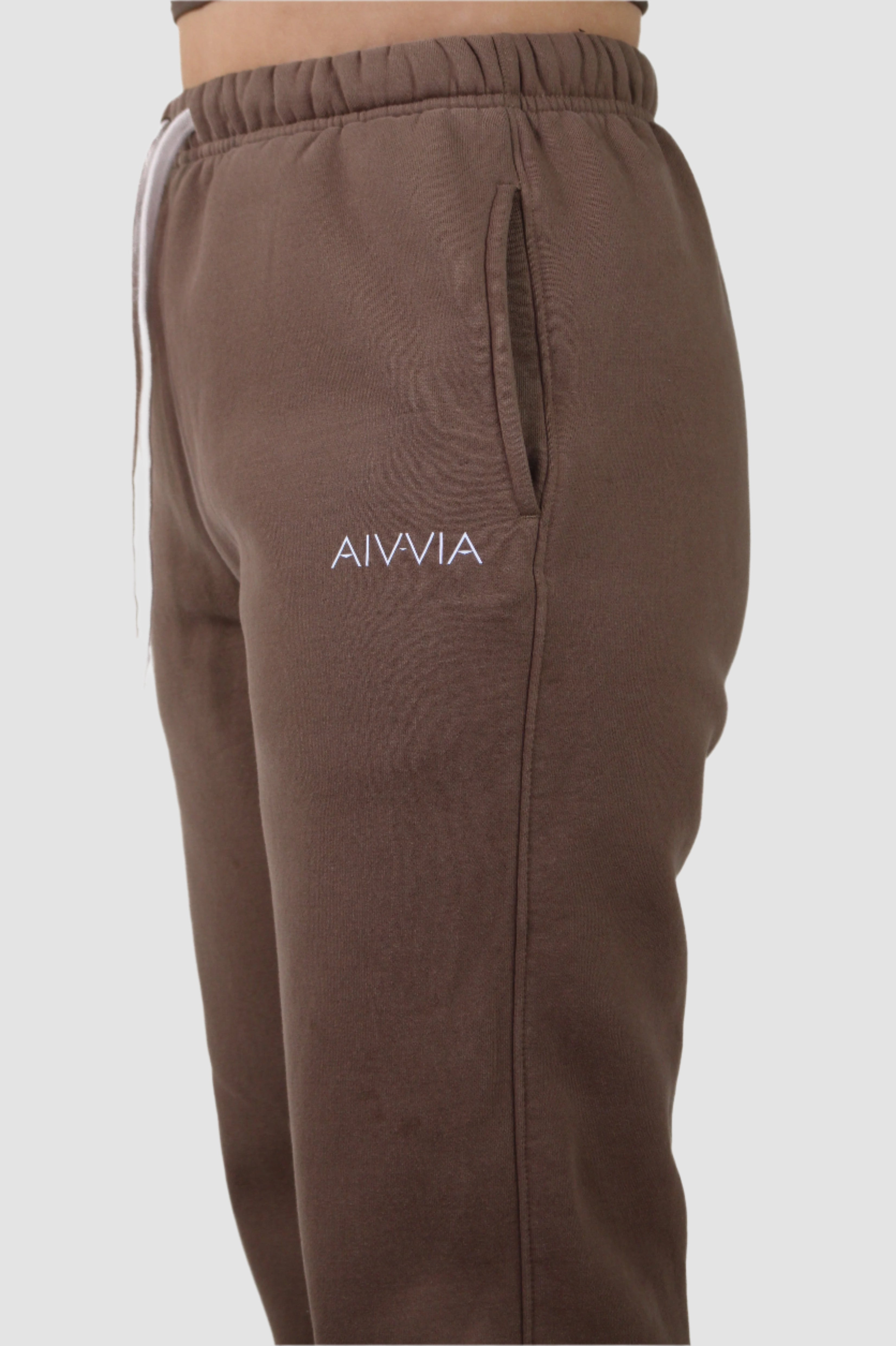 Side view of Aivvia Athletics brown sweatpants, soft fleece fabric, casual athletic wear for women.