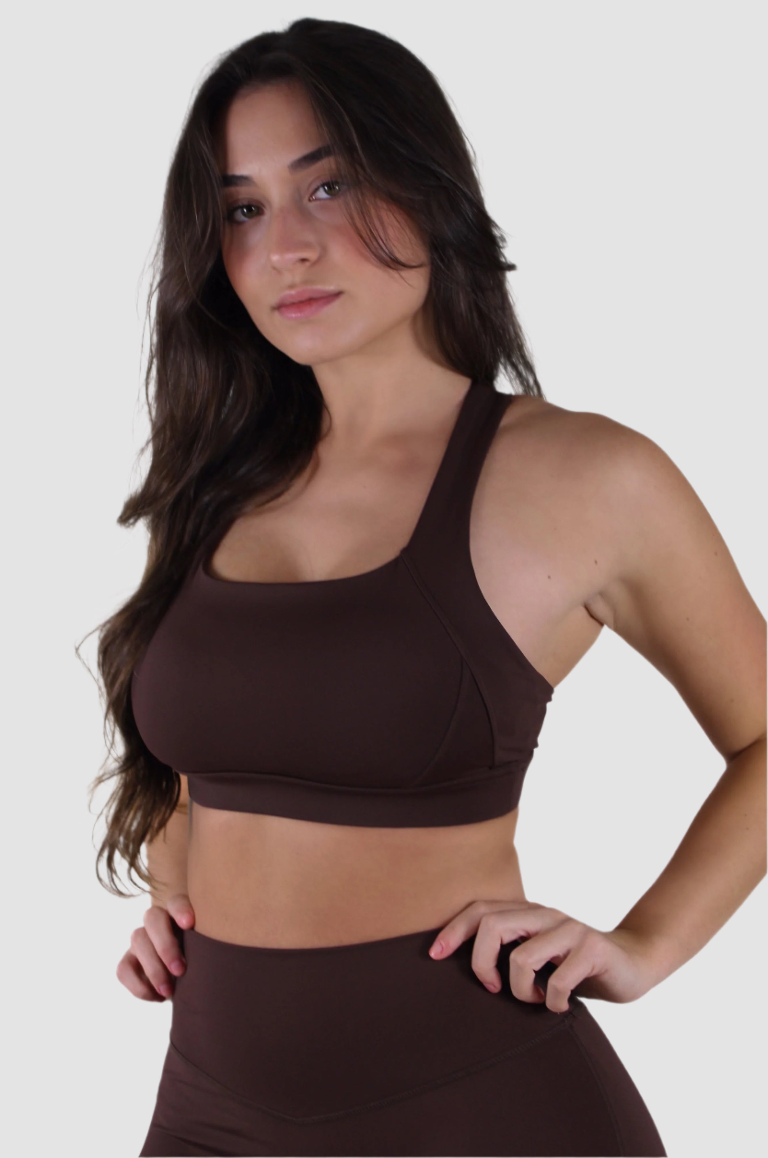 Brown Aivvia Athletics scoop-neck sports bra, fitted activewear top for workouts and yoga.